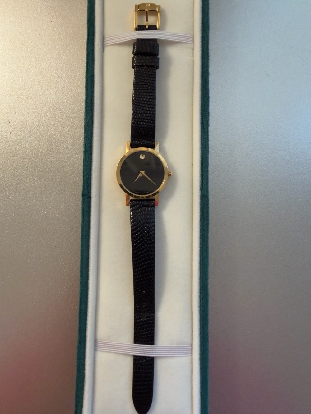 Movado Black and Gold Minimalist Wristwatch